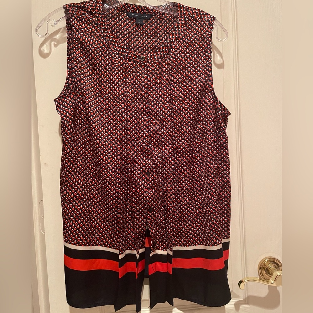 Beautiful sleeveless button down blouse, very soft great material.